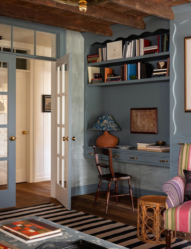 Alt Text - Comfortable and inviting home office nook with a small desk and soft lighting